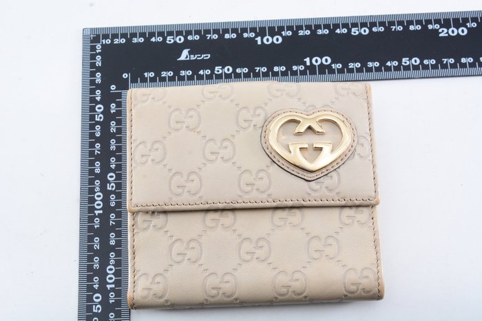 Gucci Guccissima Leather Wallet in Beige