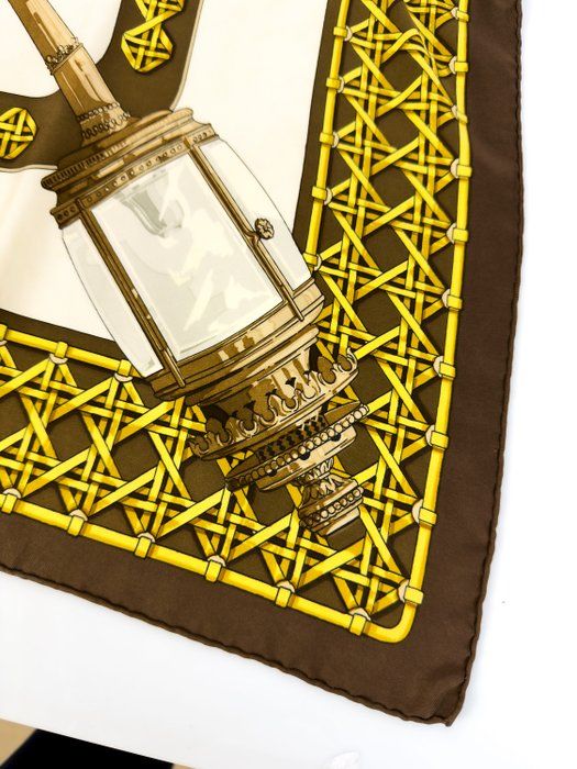 Hand-rolled hem detail on Hermès Feux de Route vintage silk scarf showing artisan finishing