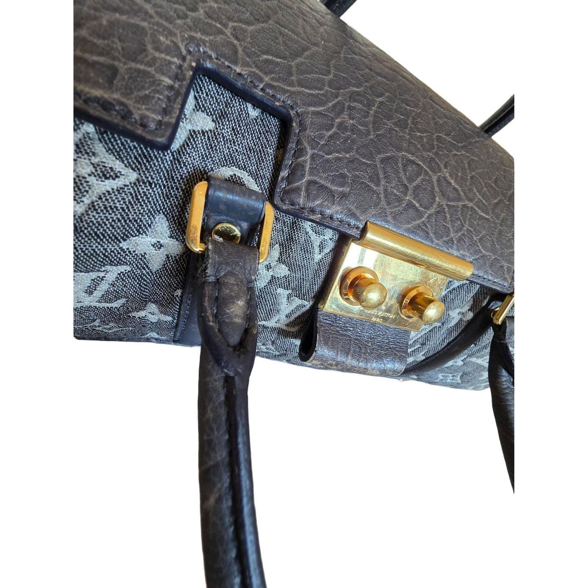 Louis Vuitton gold and grey handbag with monogram canvas and gold-plated accents.