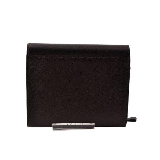 Burberry brown leather bifold wallet with embossed logo and classic design.