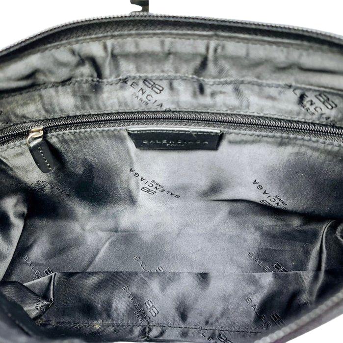Balenciaga black and red shoulder bag with signature monogram and adjustable strap.