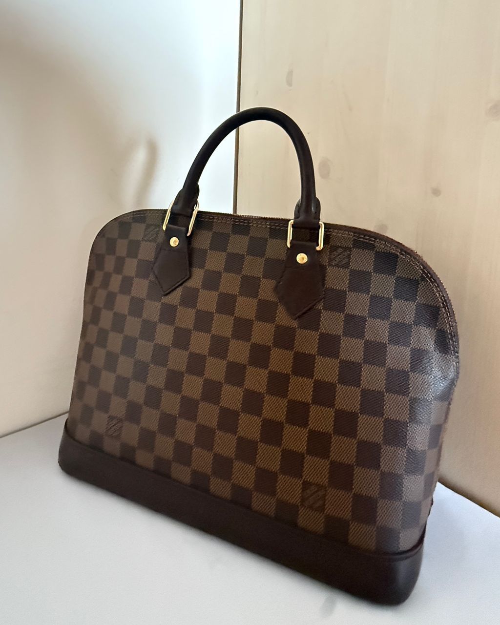 Louis Vuitton Alma PM Damier Ebene handbag, front view, Dasegna