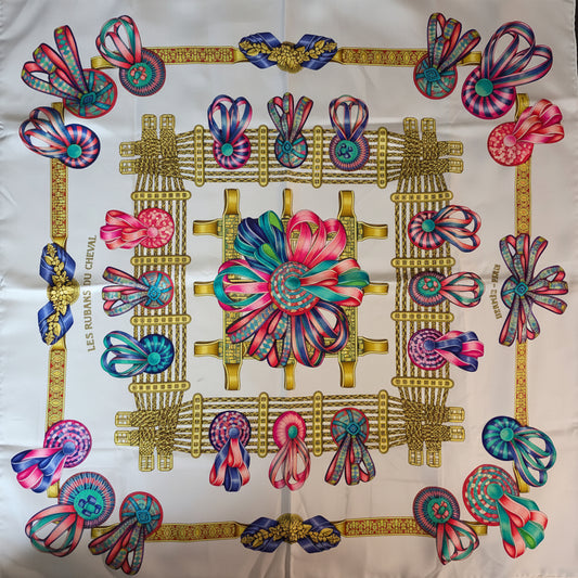 full flat lay of Hermès Les Rubans Du Cheval 90 cm silk twill scarf showing full equestrian design