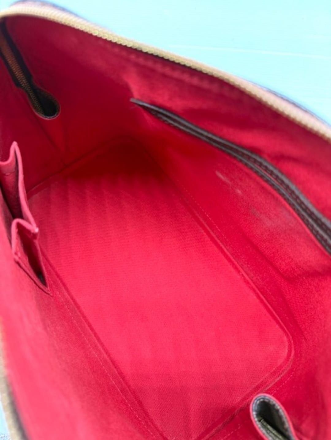 LV Alma PM, interior red lining view