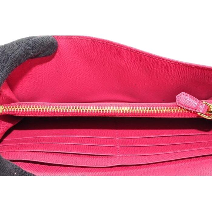 Prada pink leather wallet with logo detail and slim design, perfect for essentials.
