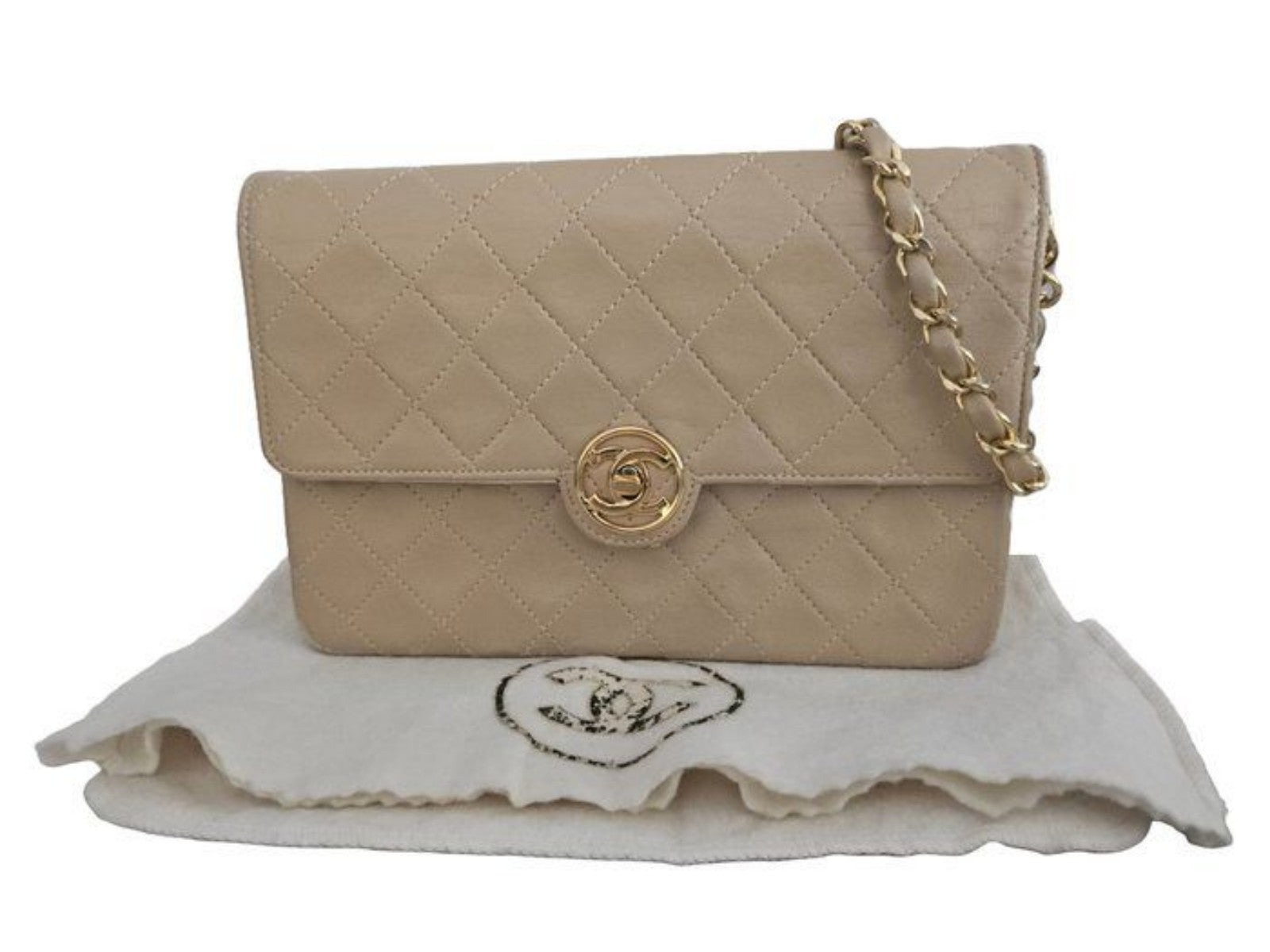 Chanel beige quilted leather flap bag with gold hardware and interlocking CC turn-lock.