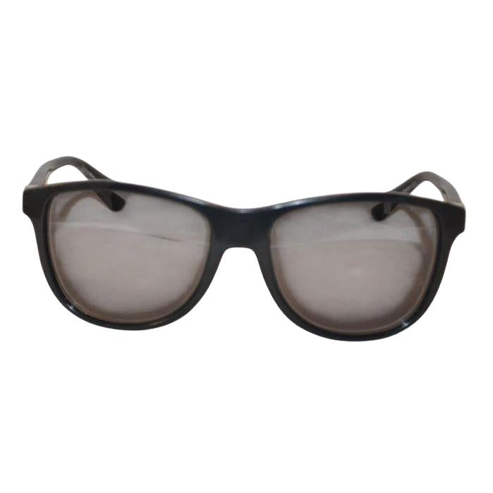 Prada black sunglasses with sleek frames, metal and plastic blend, minimalistic design.