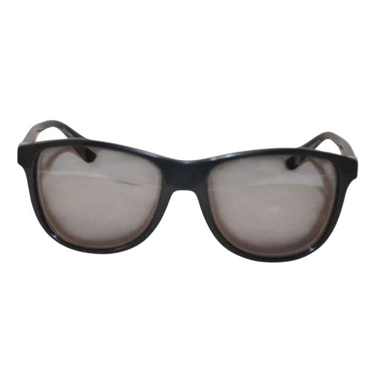 Prada black sunglasses with sleek frames, metal and plastic blend, minimalistic design.