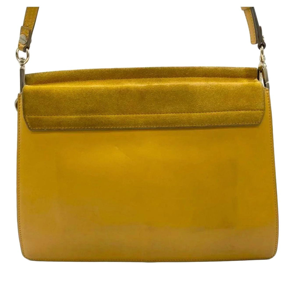 Chloè yellow messenger bag with gold-tone ring, suede and leather textures.