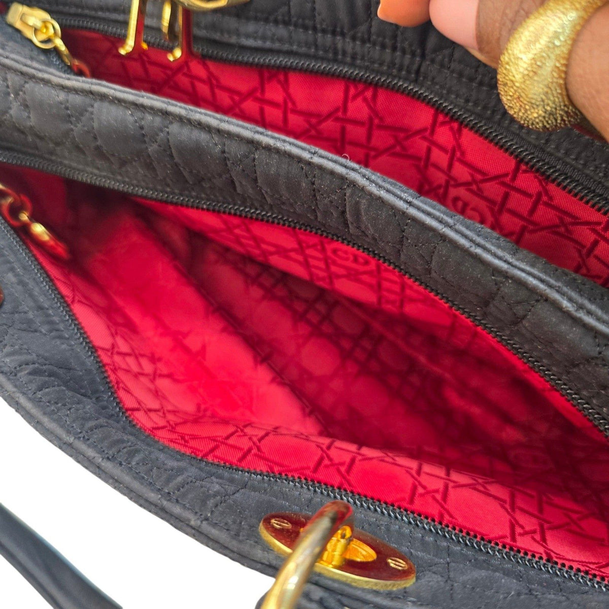 Christian Dior black quilted nylon tote bag with gold hardware and leather trim.