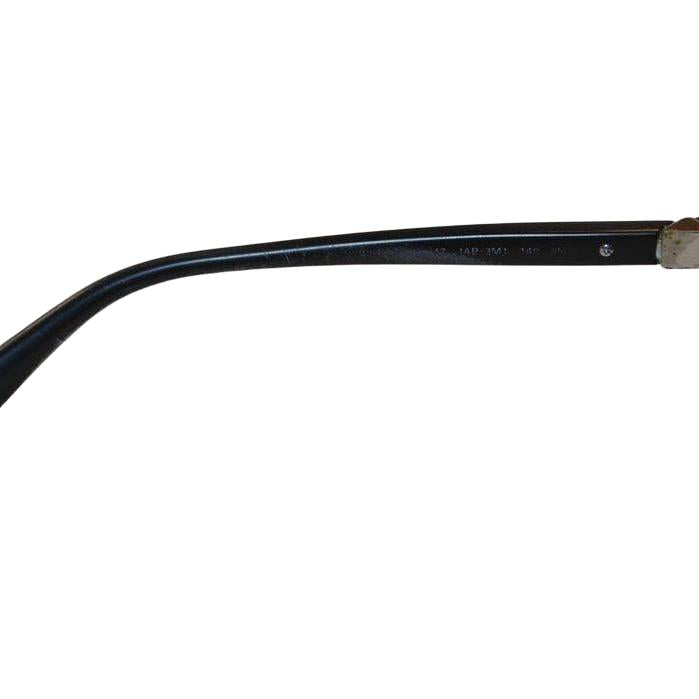 Prada black sunglasses with sleek frames, metal and plastic blend, minimalistic design.