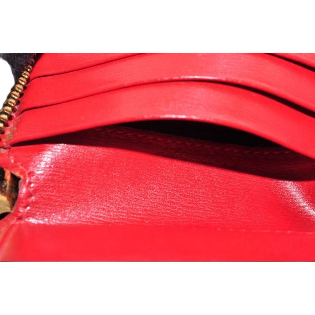 Salvatore Ferragamo cream and pink leather wallet with gold Gancini logo and zip-around design.