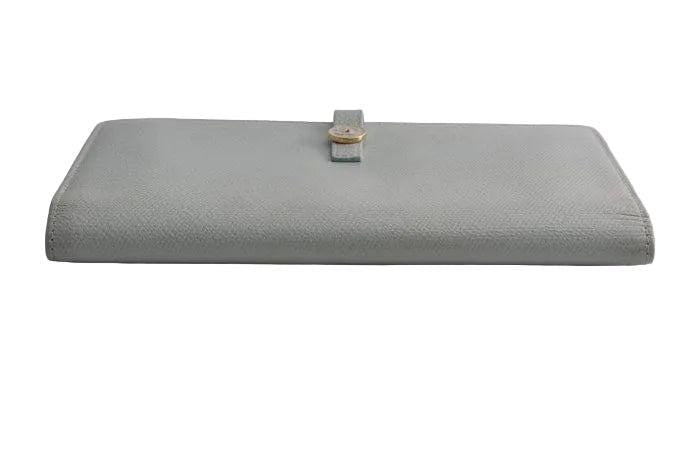 Chanel blue leather wallet with logo detail and minimalist design, featuring light scuffs.