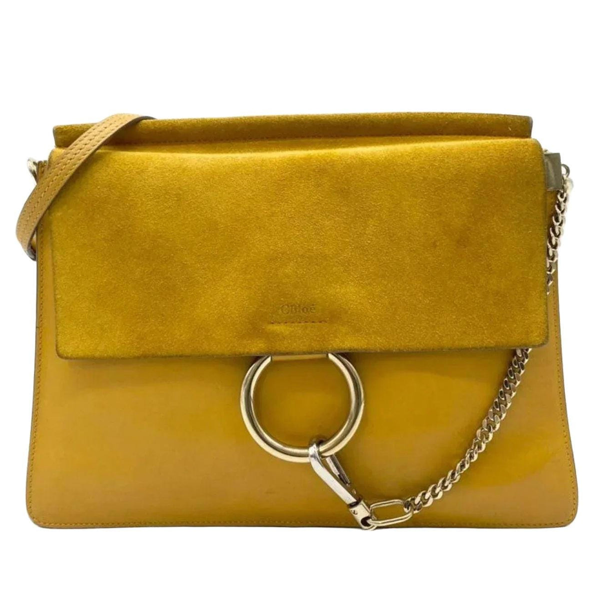 Chloè yellow messenger bag with gold-tone ring, suede and leather textures.