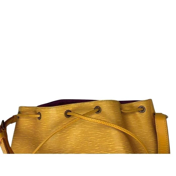 Louis Vuitton Petit Noé yellow bucket bag in Epi leather with drawstring closure.