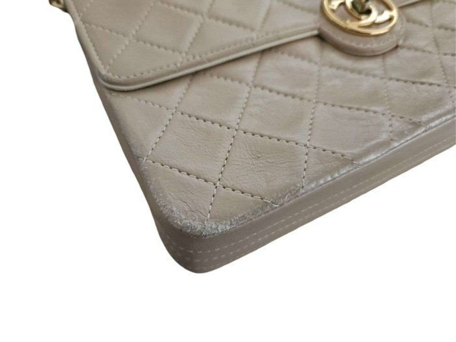 Chanel beige quilted leather flap bag with gold hardware and interlocking CC turn-lock.