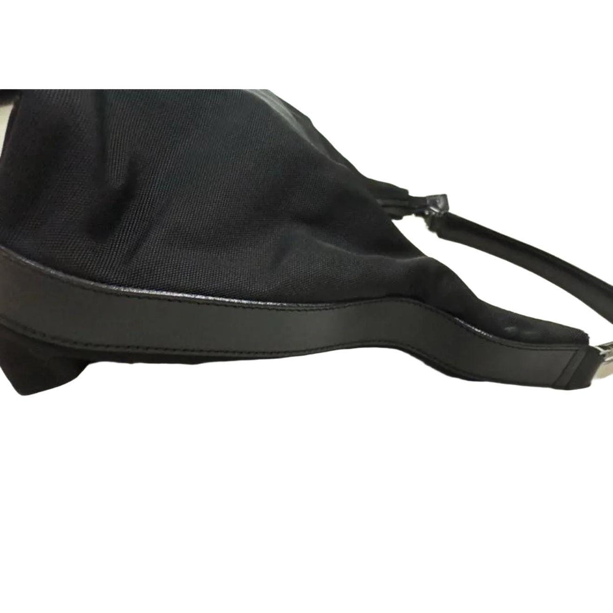 Gucci black nylon and leather shoulder bag with silver accents and logo detail.
