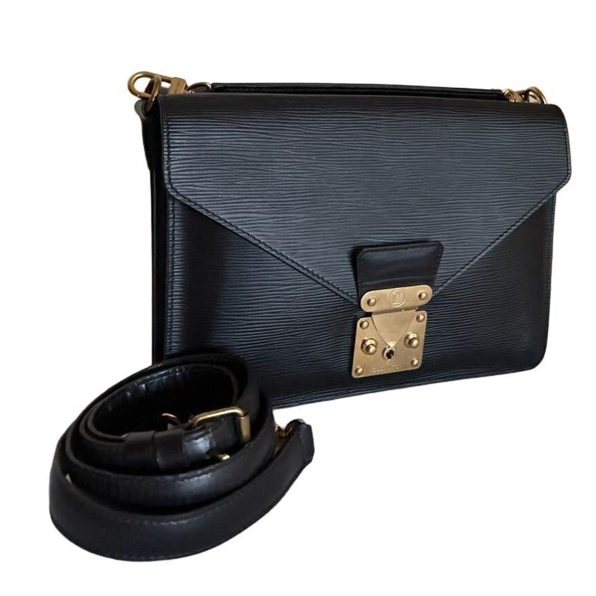 Louis Vuitton black Monceau crossbody bag in textured Epi leather with gold-tone S-lock closure.