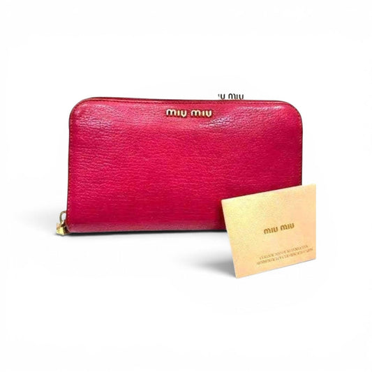 Miu Miu pink leather wallet with elegant design and signature feminine aesthetic.