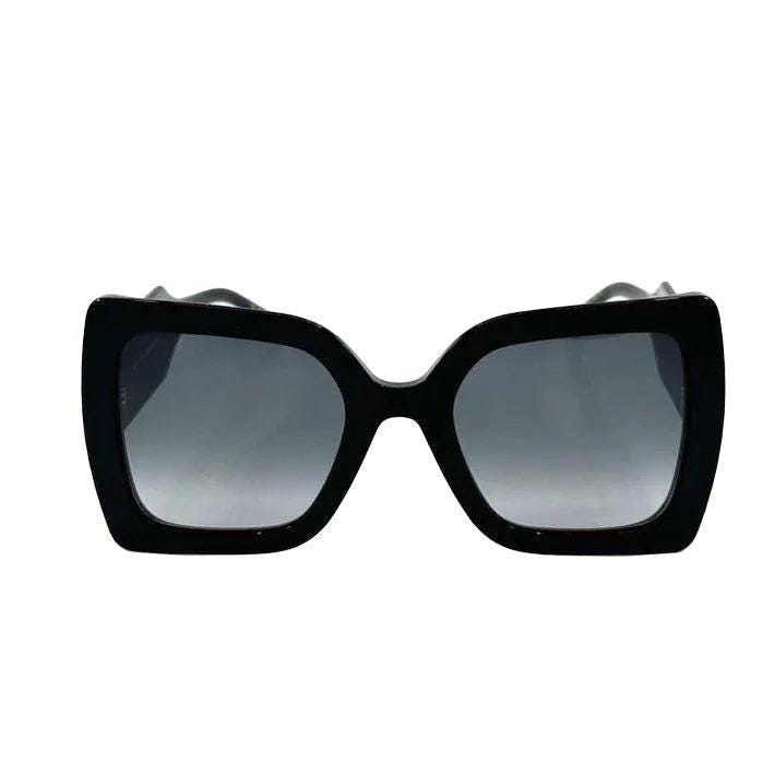 Carolina Herrera black acetate sunglasses with grey lenses and signature logo detailing.