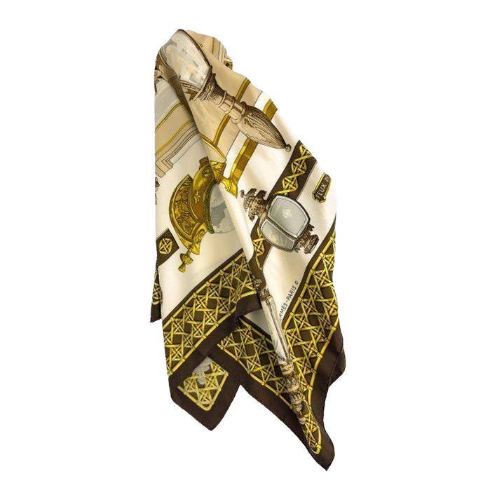 Hermès cream silk twill scarf with 'Feux de Route' design and hand-rolled hems.