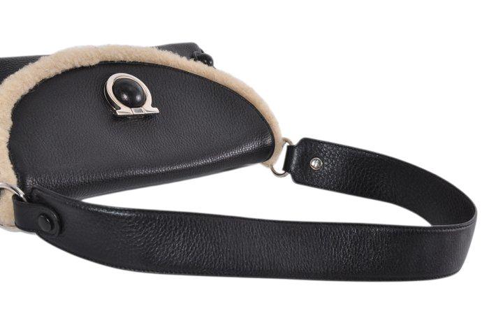 Salvatore Ferragamo black leather purse with shearling trim and Gancini hardware.