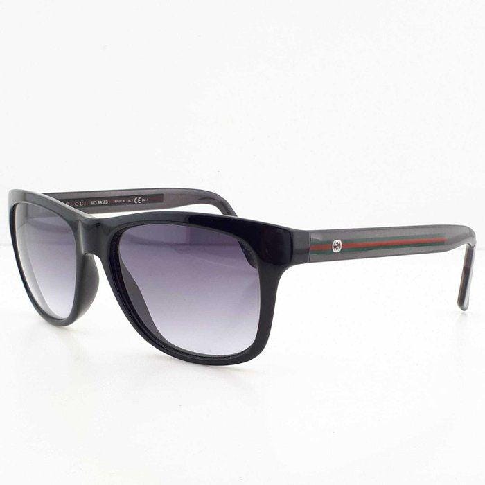 Gucci black Wayfarer sunglasses with grey gradient lenses and red-green striped temples.
