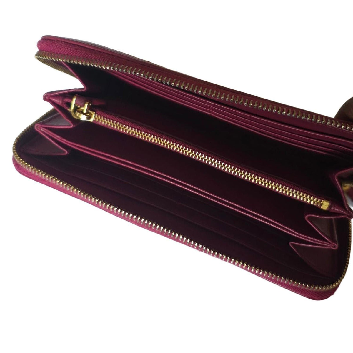 Prada pink nylon and leather zip-around wallet with minimalist design and secure closure.