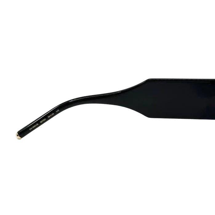 Carolina Herrera black acetate sunglasses with grey lenses and signature logo detailing.