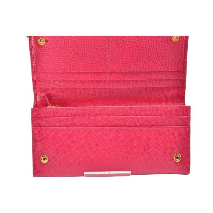 Prada pink leather wallet with logo detail and slim design, perfect for essentials.