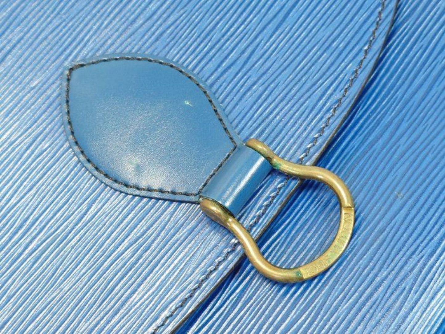 Louis Vuitton blue Epi leather crossbody bag with signature LV logo and brass hardware.