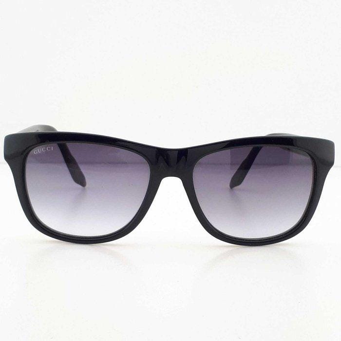 Gucci black Wayfarer sunglasses with grey gradient lenses and red-green striped temples.