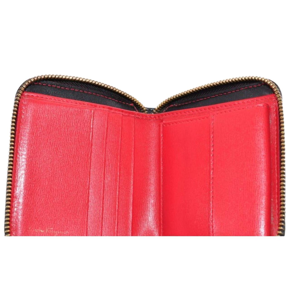 Salvatore Ferragamo cream and pink leather wallet with gold Gancini logo and zip-around design.