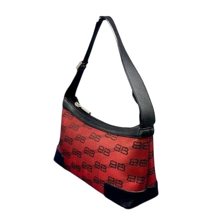 Balenciaga black and red shoulder bag with signature monogram and adjustable strap.