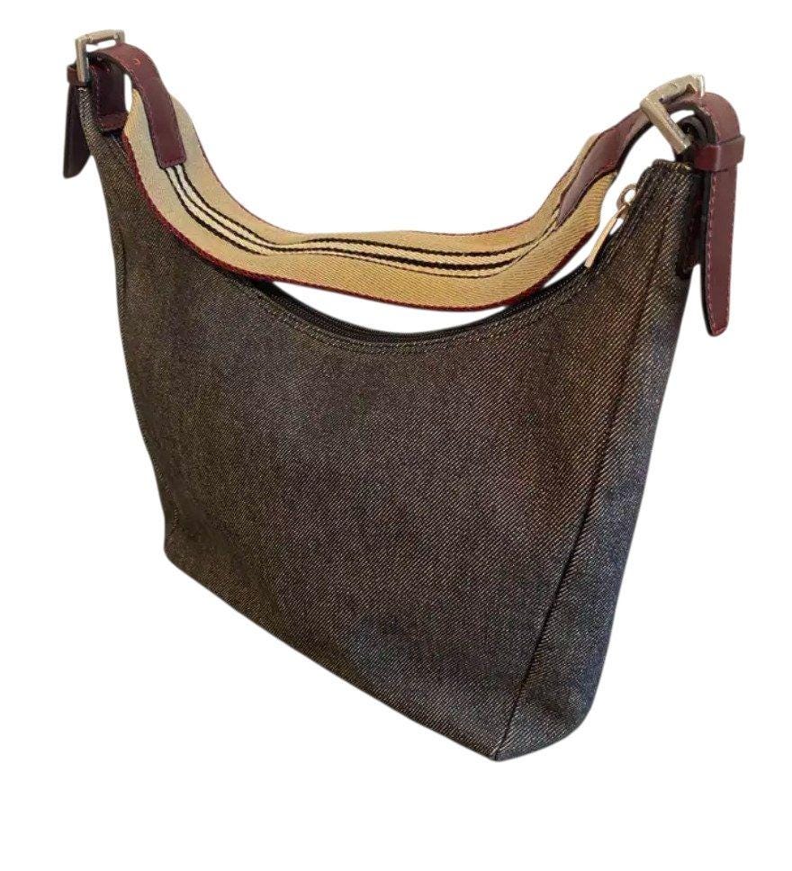 Burberry blue denim shoulder bag with leather trim and polished metal hardware.