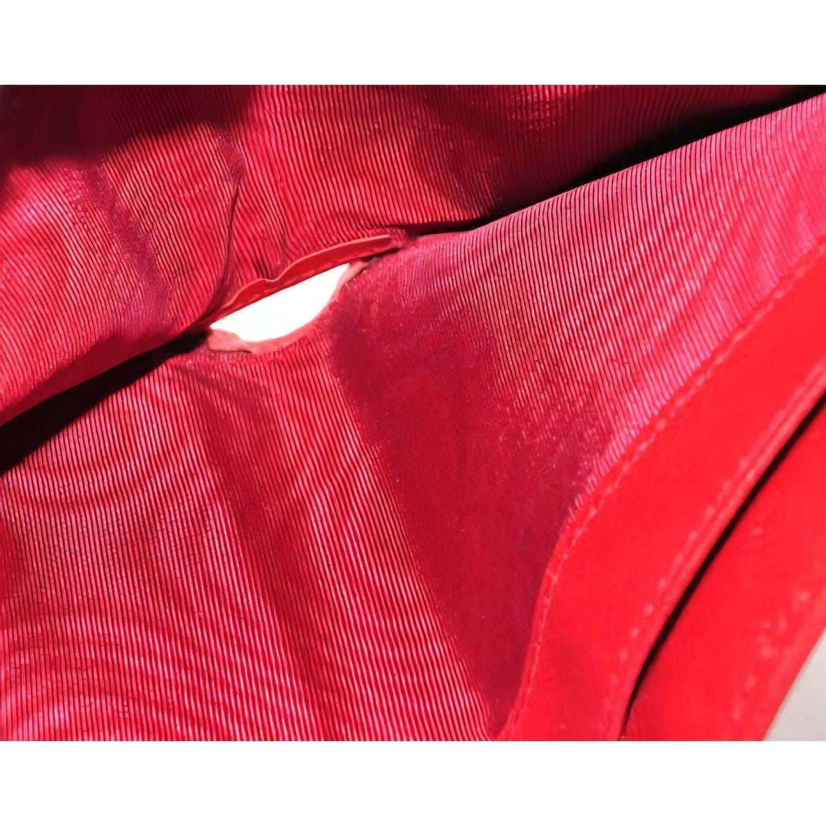 Salvatore Ferragamo red leather wallet with gold hardware and organized interior.