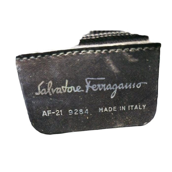 Salvatore Ferragamo black hobo bag hammered leather with metal accents and structured silhouette.
