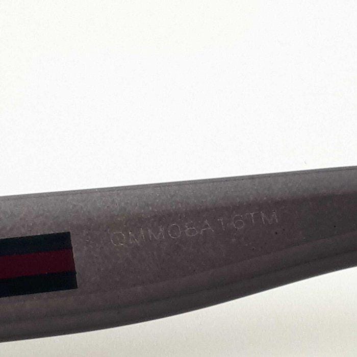 Gucci black Wayfarer sunglasses with grey gradient lenses and red-green striped temples.