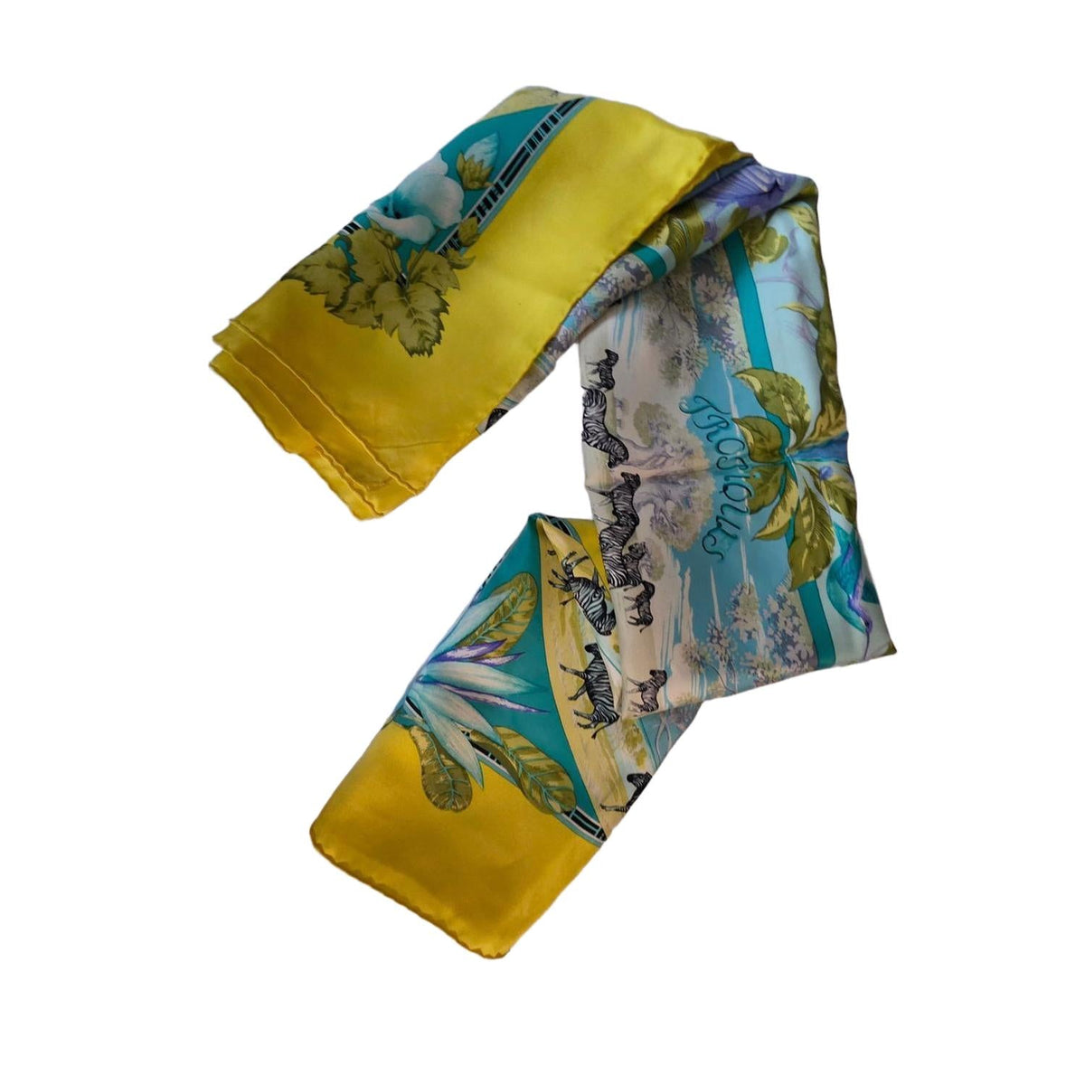 Hermès yellow silk twill shawl featuring tropical animal prints and hand-rolled edges.