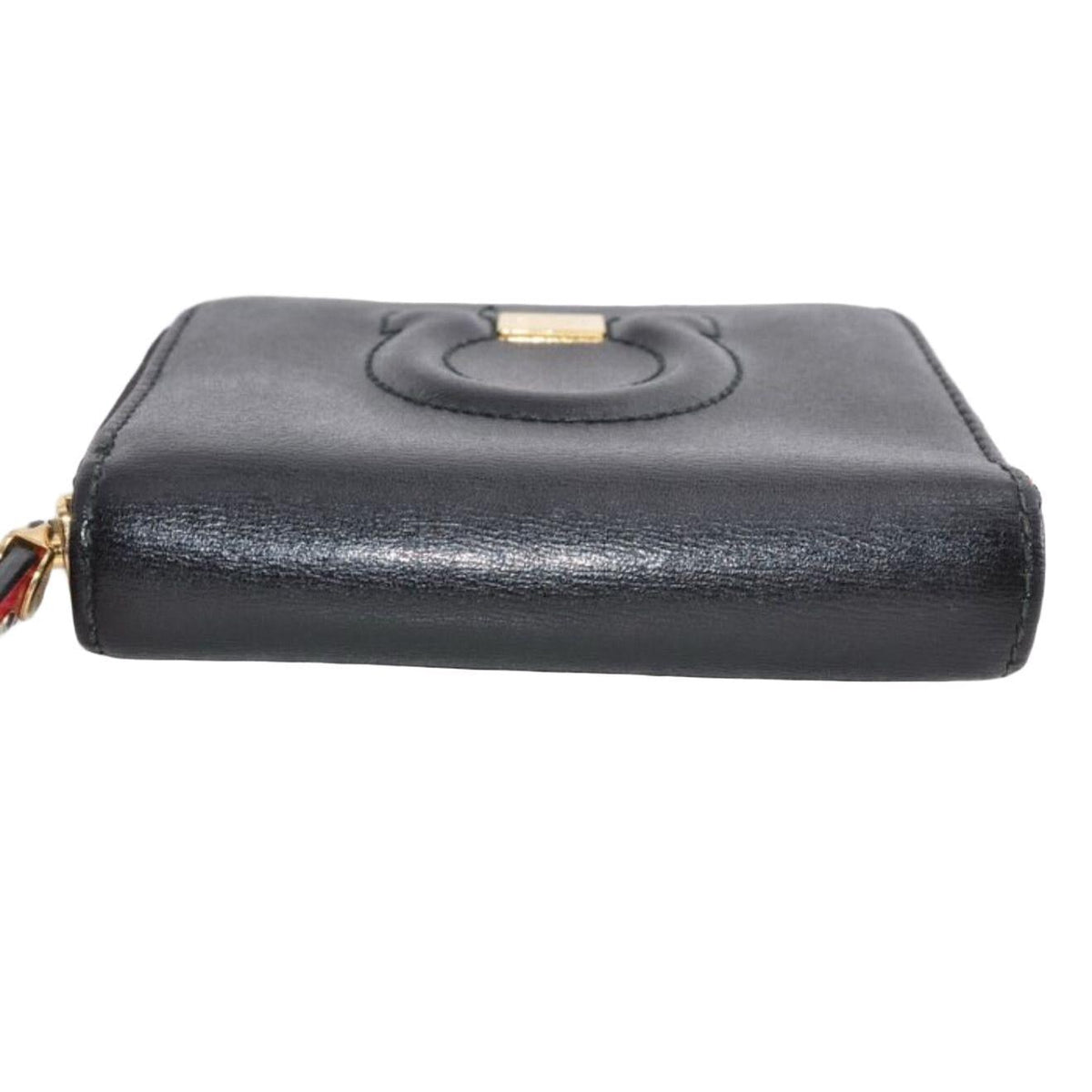 Salvatore Ferragamo cream and pink leather wallet with gold Gancini logo and zip-around design.