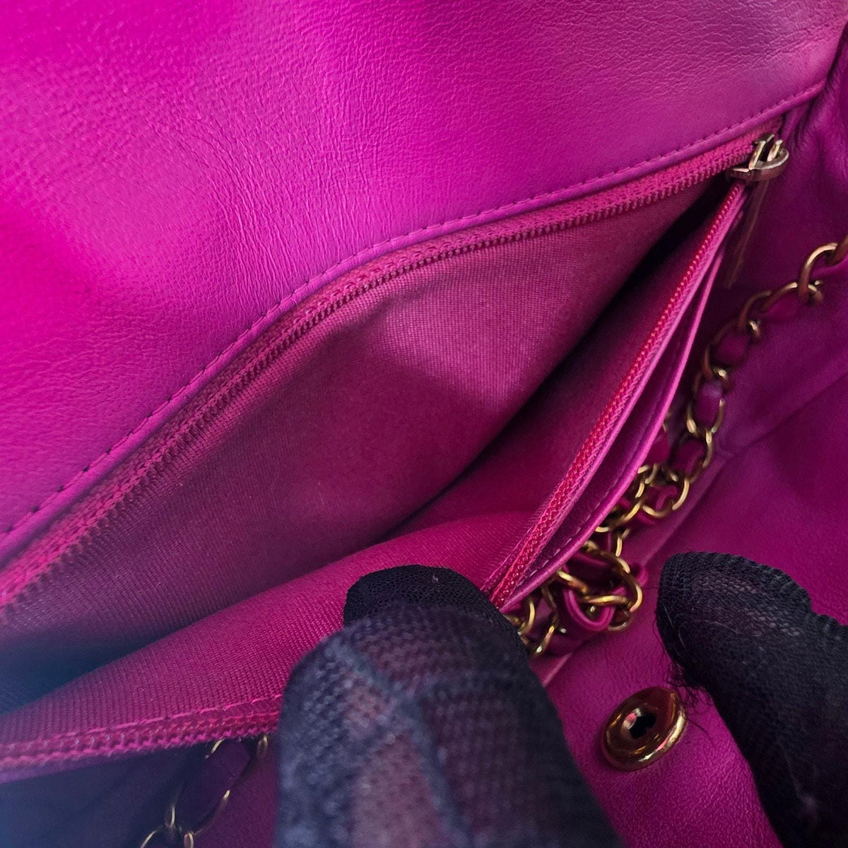 Chanel pink mini messenger bag in chevron leather with gold CC clasp and hardware.