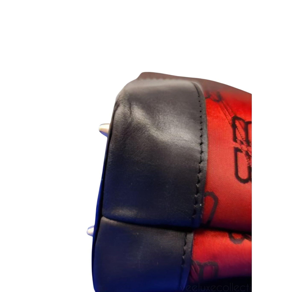 Balenciaga black and red shoulder bag with signature monogram and adjustable strap.