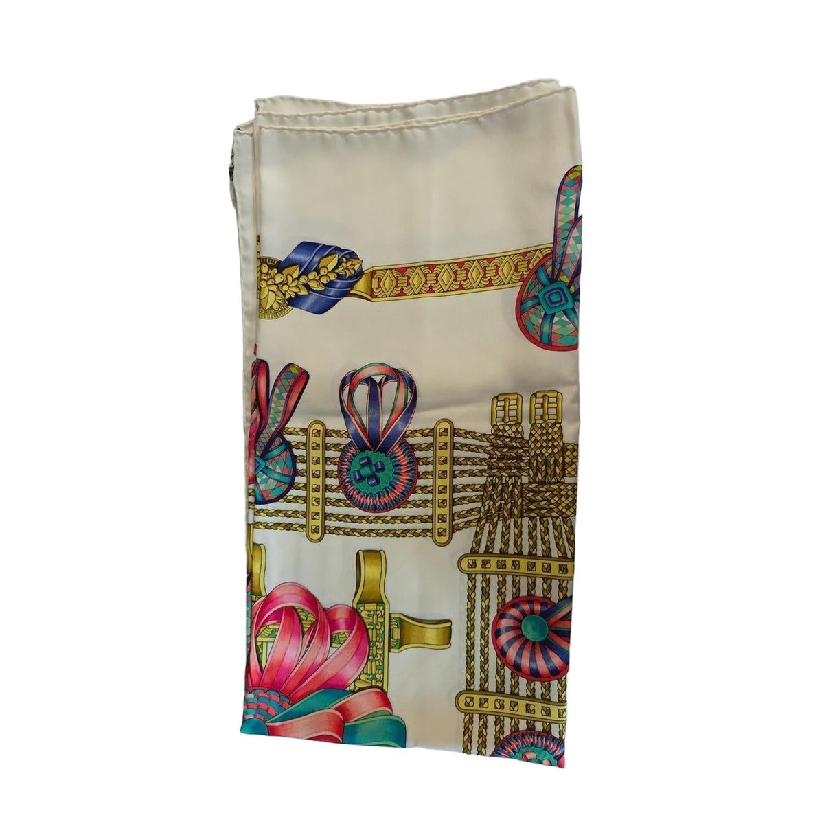 Hermès beige silk scarf featuring equestrian ribbon pattern and hand-rolled edges.
