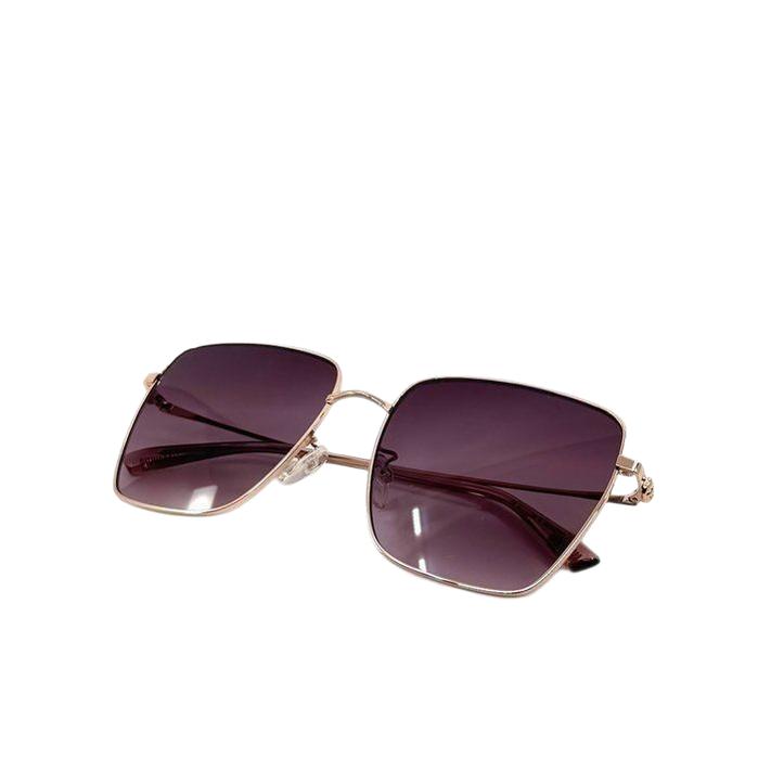 Moschino gold sunglasses with pink tinted lenses and iconic logo on temples.