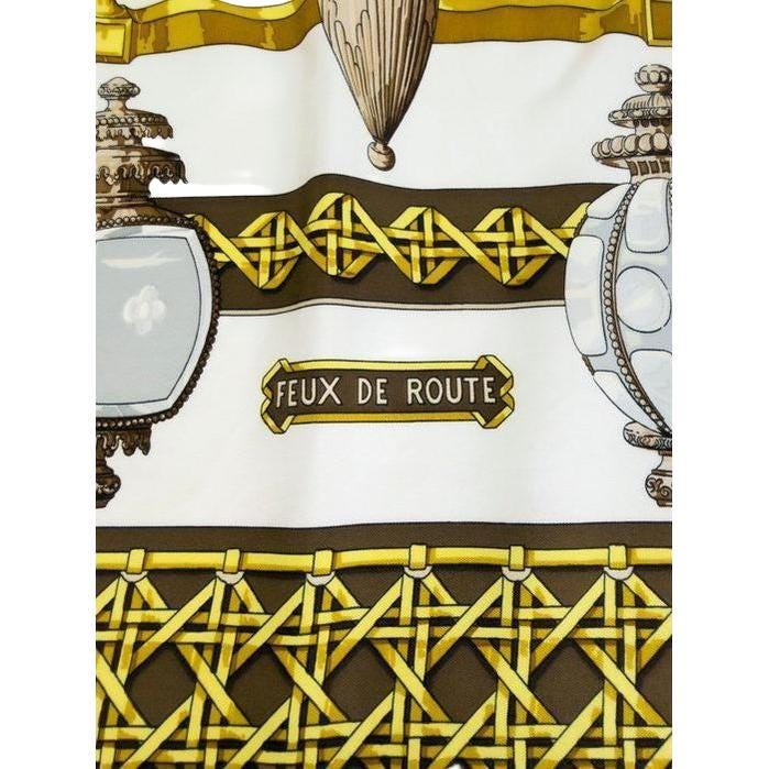 Hermès cream silk twill scarf with 'Feux de Route' design and hand-rolled hems.