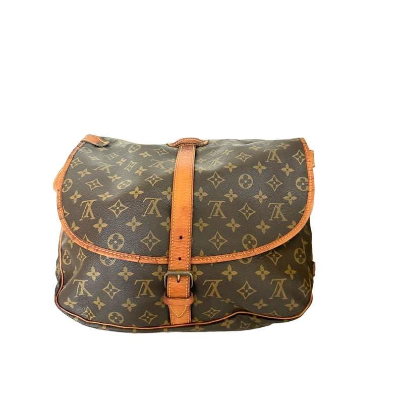 Louis Vuitton brown messenger bag Monogram canvas with vachetta leather trims and gold hardware.