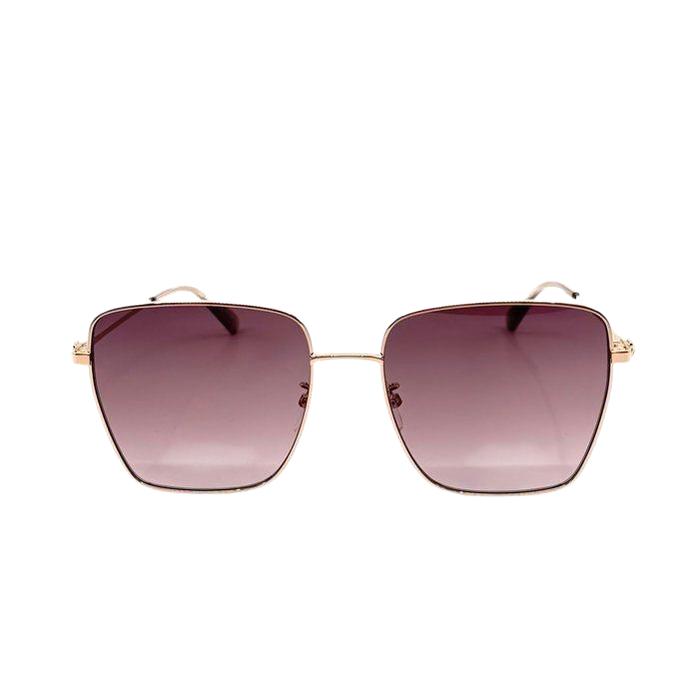 Moschino gold sunglasses with pink tinted lenses and iconic logo on temples.