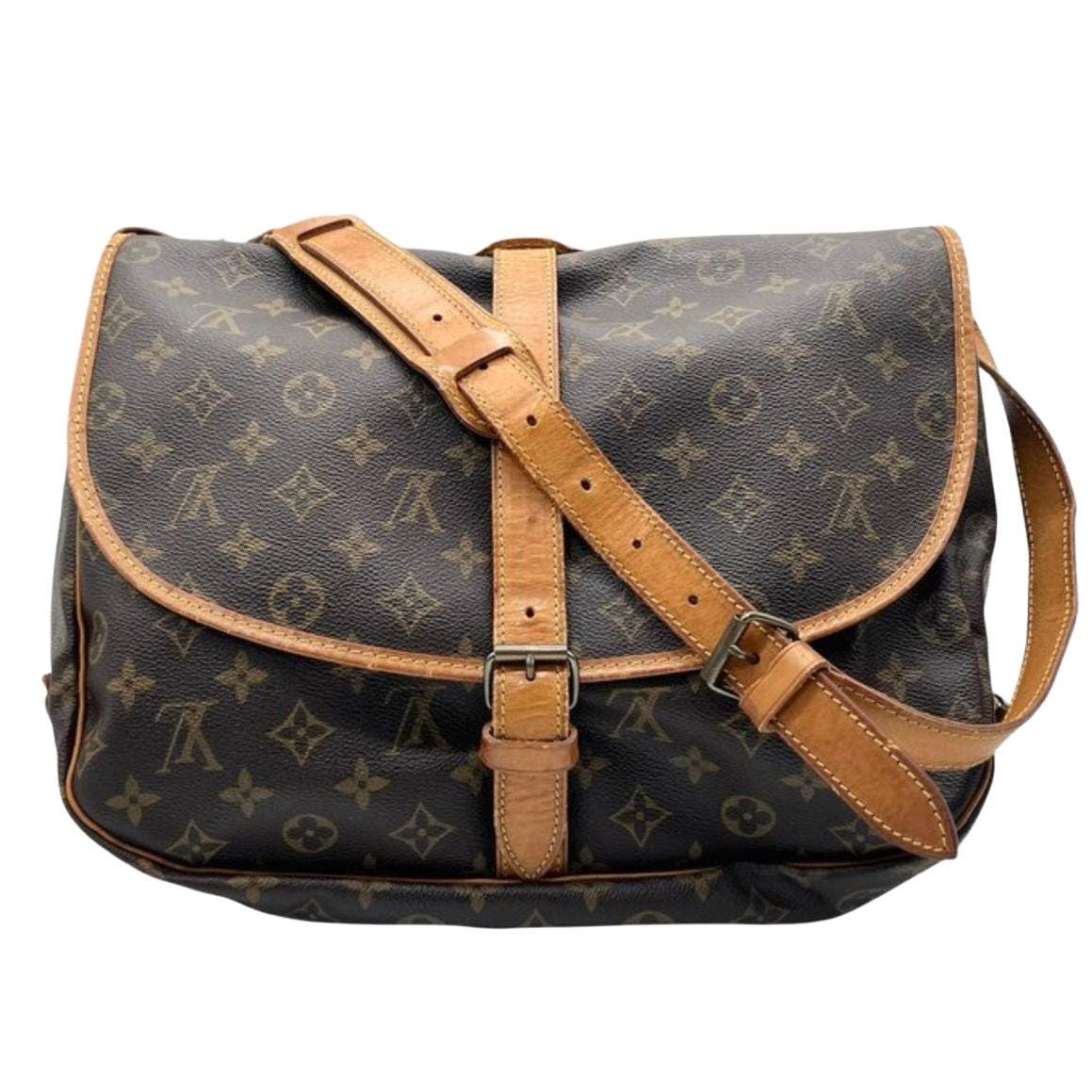 Louis Vuitton brown messenger bag Monogram canvas with vachetta leather trims and gold hardware.