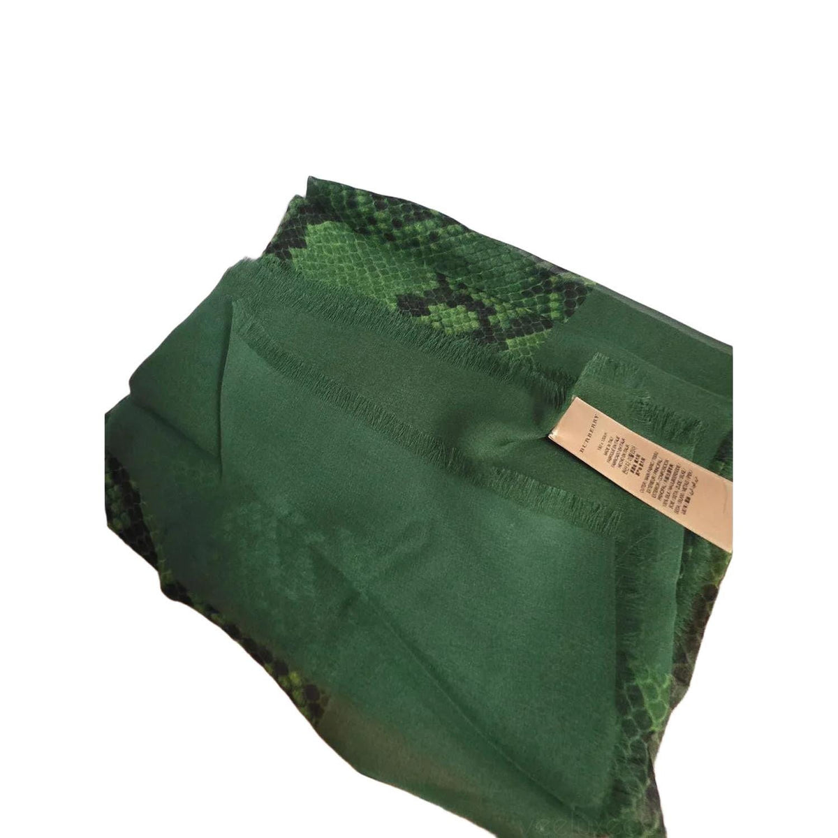 Burberry green silk scarf with delicate fringed edges and vibrant hue.