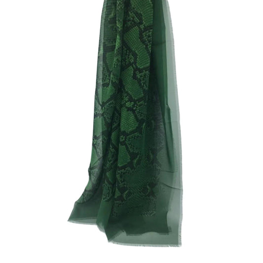 Burberry green silk scarf with delicate fringed edges and vibrant hue.